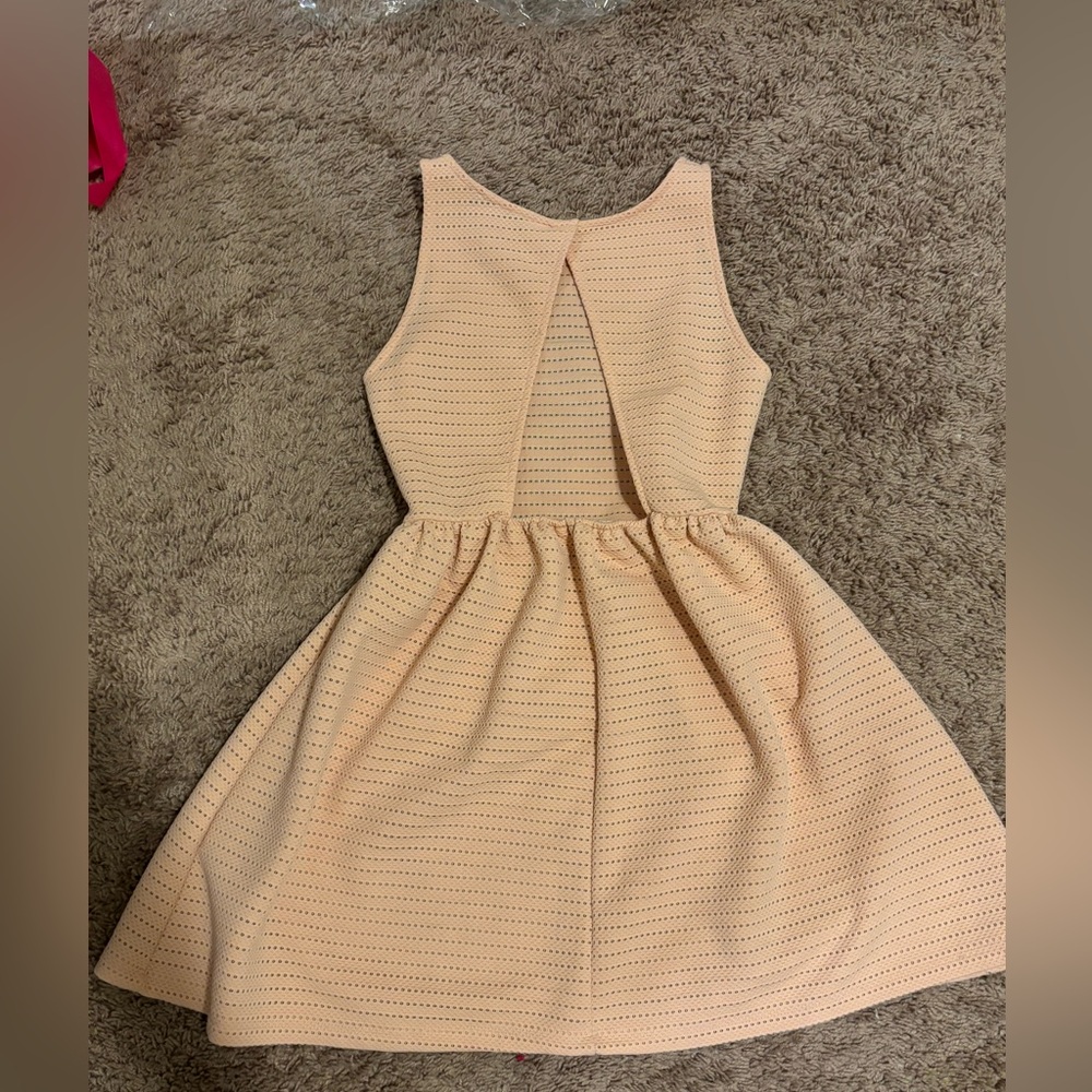 Light pink mini dress with back part out